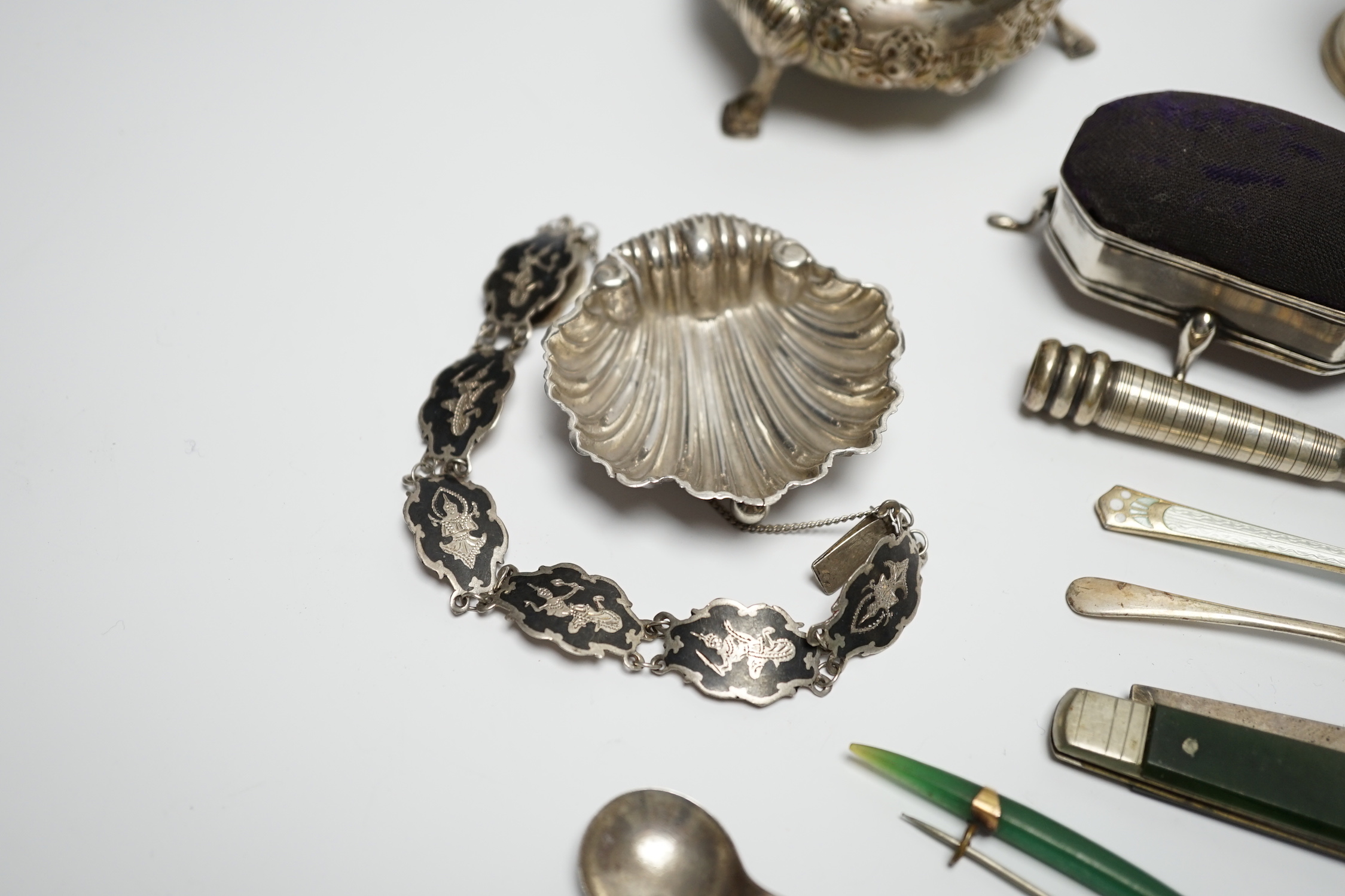 A late Victorian silver bun salt and other items including silver mounted pin cushion, silver shell salt, spoons etc.